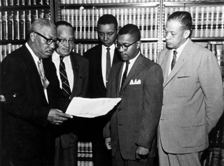 Attorney Conrad Odell Pearson (left) with attorneys, Hugh Thompson, Floyd McKissick, William G. Marsh, and John H. Wheeler.   Photo courtesy of The Herald Sun. Originally from North Carolina Collection, Durham County Library.