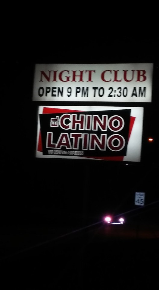 Roadside signage lights the way to El Chino Latino