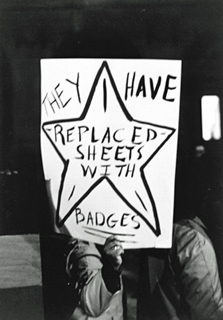 A protest sign from the rally, linking police and Klan violence. Photo by Bill Boyarsky